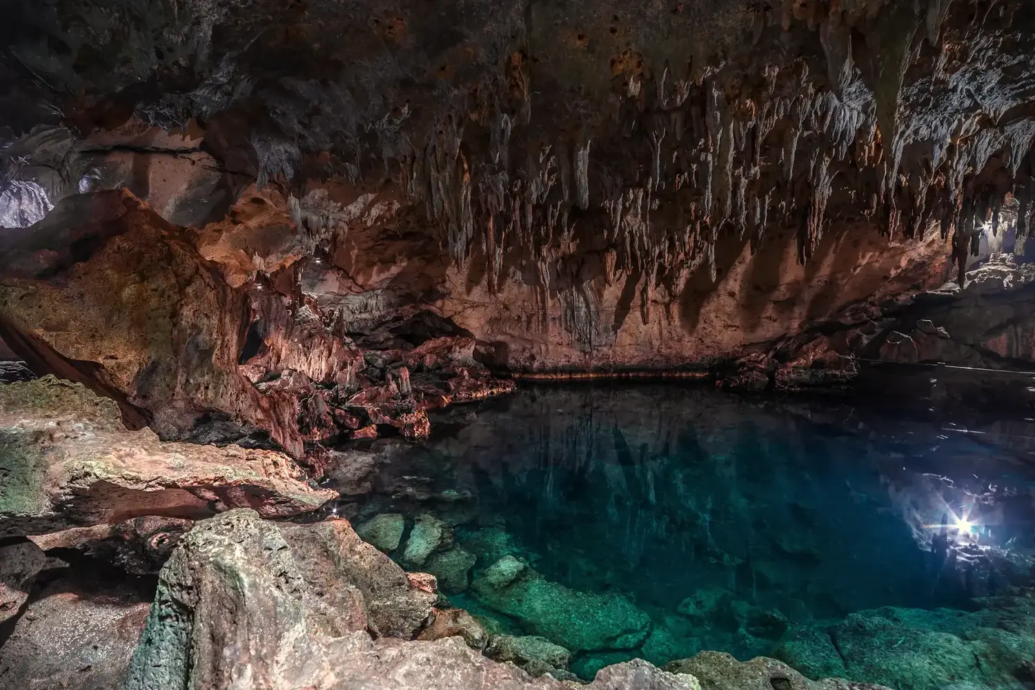 The stone platform and light shaft inside Cenote Suytun, near Valladolid